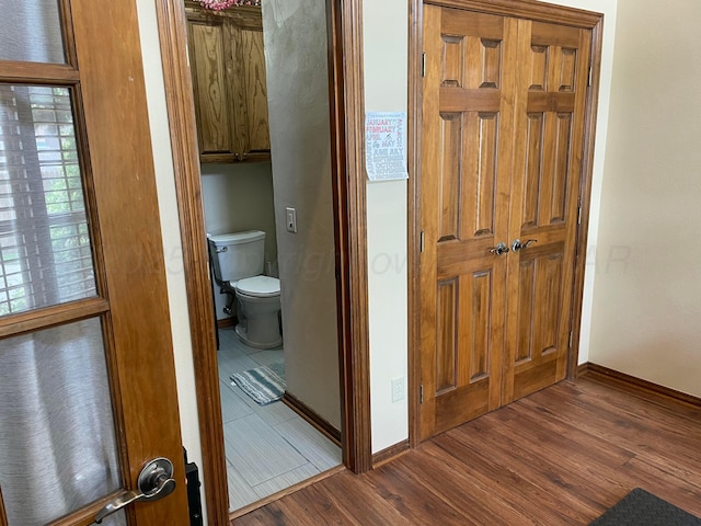 7 Pebble Beach Ct, Amarillo, TX 79124 - bathroom with wood finished floors, toilet, and baseboards