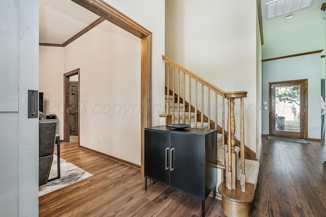 7 Pebble Beach Ct, Amarillo, TX 79124 - foyer entrance featuring stairs, wood finished floors, crown molding, baseboards, and a towering ceiling