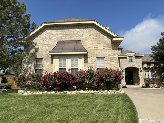 7 Pebble Beach Ct, Amarillo, TX 79124 - french country style house with a front lawn