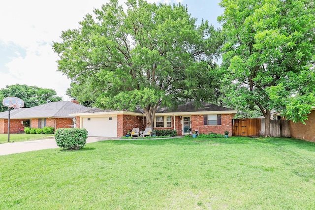 6006 Elmhurst Rd, Amarillo, TX 79106 - ranch-style home with brick siding, an attached garage, and driveway