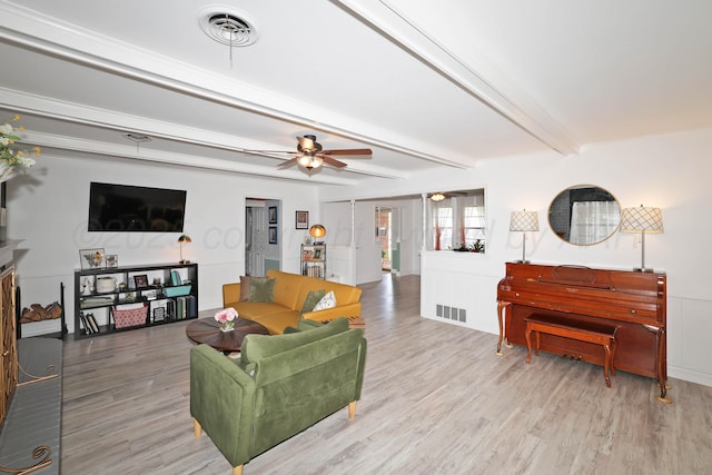 6006 Elmhurst Rd, Amarillo, TX 79106 - living room with wood finished floors, ceiling fan, and beamed ceiling