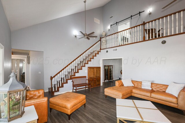 620 N Main St, Stratford, TX 79084 - living area with high vaulted ceiling, a ceiling fan, dark wood-style floors, and stairway