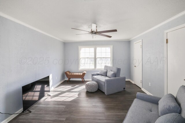 620 N Main St, Stratford, TX 79084 - living room with a ceiling fan, dark wood-type flooring, ornamental molding, and baseboards