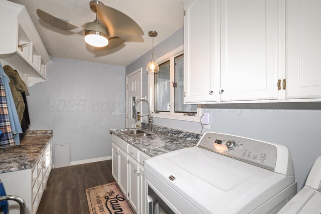 620 N Main St, Stratford, TX 79084 - laundry room with cabinet space, dark wood-style floors, a ceiling fan, separate washer and dryer, and baseboards