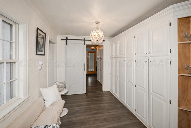 620 N Main St, Stratford, TX 79084 - corridor with a barn door, a chandelier, dark wood-type flooring, and ornamental molding