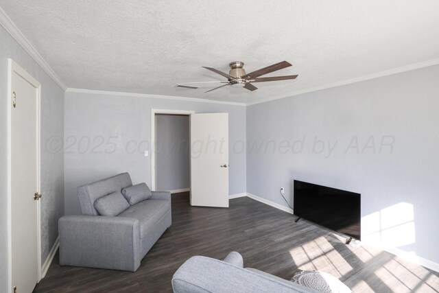 620 N Main St, Stratford, TX 79084 - living room with dark wood-style flooring, baseboards, ceiling fan, ornamental molding, and a textured ceiling