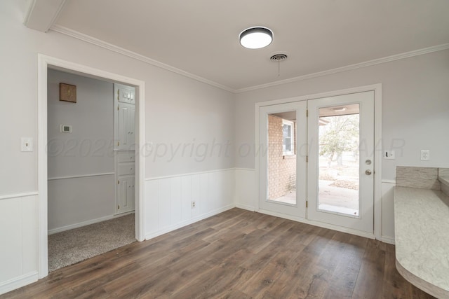 interior space featuring crown molding and dark hardwood / wood-style floors