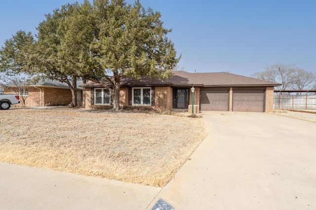 ranch-style home featuring a garage