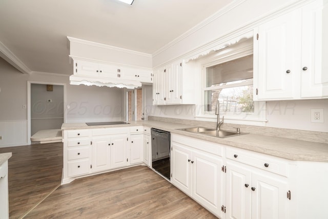 kitchen featuring white cabinetry, sink, ornamental molding, and black appliances