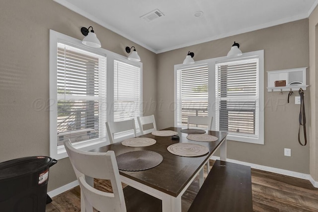 2004 Pheasant Ln, Amarillo, TX 79118 - dining room with dark wood-type flooring and ornamental molding