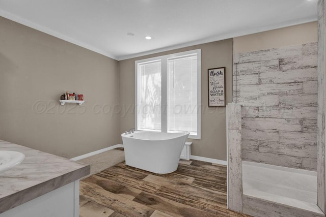 2004 Pheasant Ln, Amarillo, TX 79118 - full bathroom featuring a freestanding tub, wood finished floors, vanity, a shower, and recessed lighting