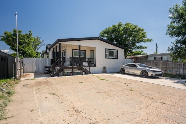 2004 Pheasant Ln, Amarillo, TX 79118 - manufactured / mobile home with covered porch and stairway