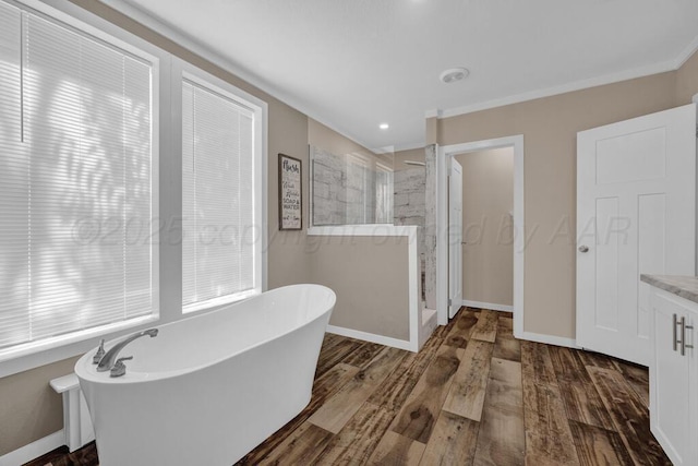 2004 Pheasant Ln, Amarillo, TX 79118 - full bathroom with walk in shower, a freestanding tub, wood finished floors, vanity, and crown molding