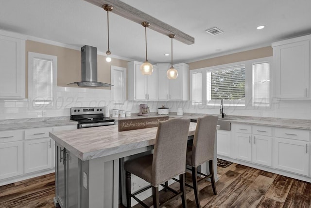 2004 Pheasant Ln, Amarillo, TX 79118 - kitchen with electric range, wall chimney exhaust hood, backsplash, white cabinets, and ornamental molding