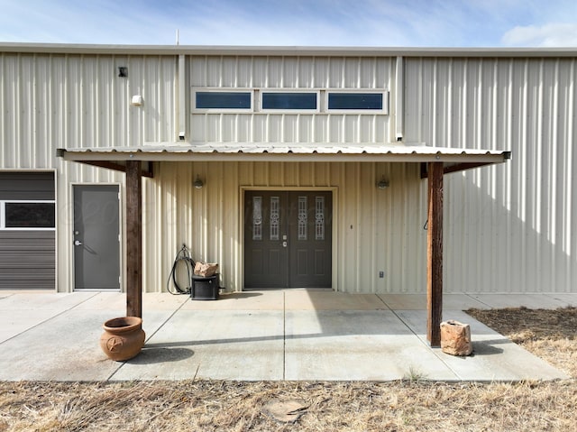 8801 Sharman Loop, Amarillo, TX 79124 - entrance to property featuring board and batten siding and a patio area