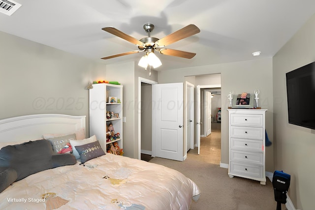 2701 Daybreak Ln, Amarillo, TX 79124 - bedroom featuring light carpet, baseboards, and ceiling fan