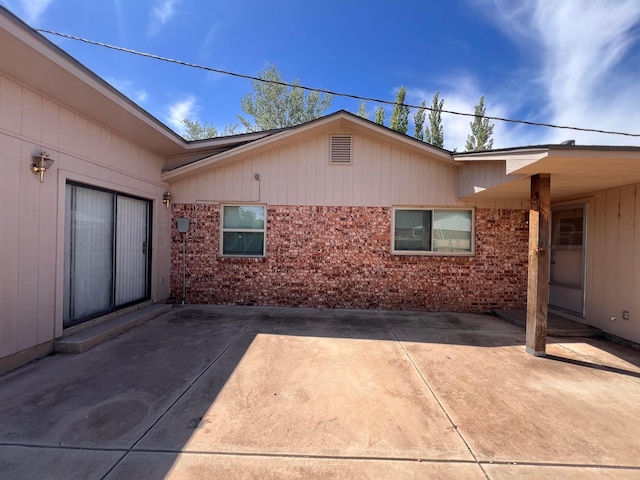 224 Beach St, Hereford, TX 79045 - exterior space featuring brick siding and a patio area