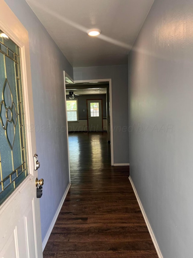 224 Beach St, Hereford, TX 79045 - hall with baseboards and wood finished floors