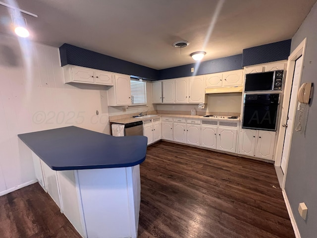 224 Beach St, Hereford, TX 79045 - kitchen featuring a sink, white cabinets, a peninsula, electric cooktop, and oven