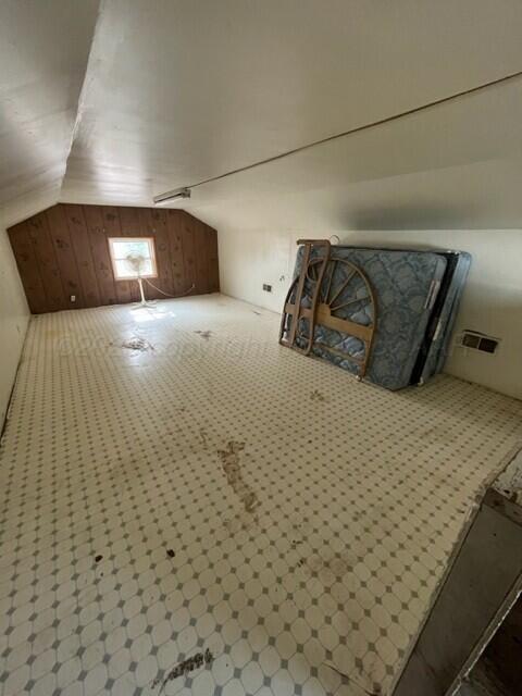 819 Ave N, Sunray, TX 79086 - additional living space with lofted ceiling and wood walls