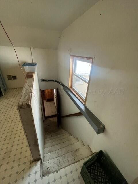 819 Ave N, Sunray, TX 79086 - stairs with tile patterned floors and lofted ceiling