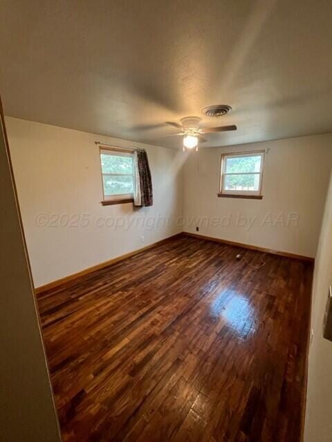 819 Ave N, Sunray, TX 79086 - empty room with wood finished floors and ceiling fan