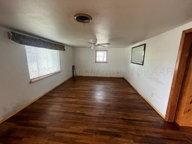 819 Ave N, Sunray, TX 79086 - spare room with wood finished floors and a ceiling fan