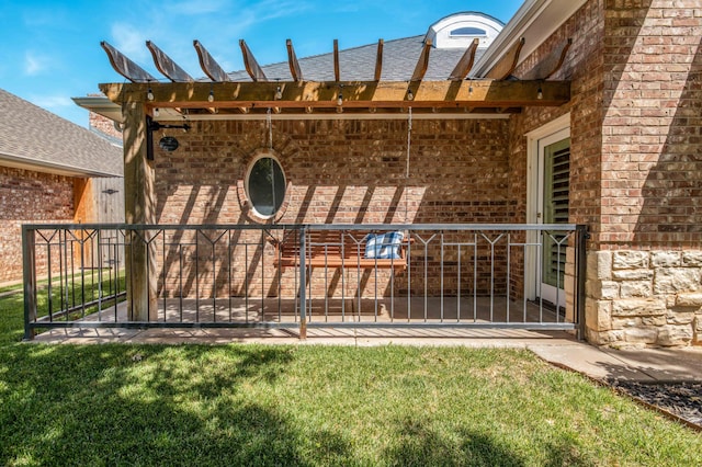 5007 Wesley Rd, Amarillo, TX 79119 - view of exterior entry with brick siding, a lawn, and a pergola