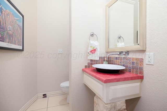 5007 Wesley Rd, Amarillo, TX 79119 - half bathroom with tile patterned flooring, backsplash, and vanity