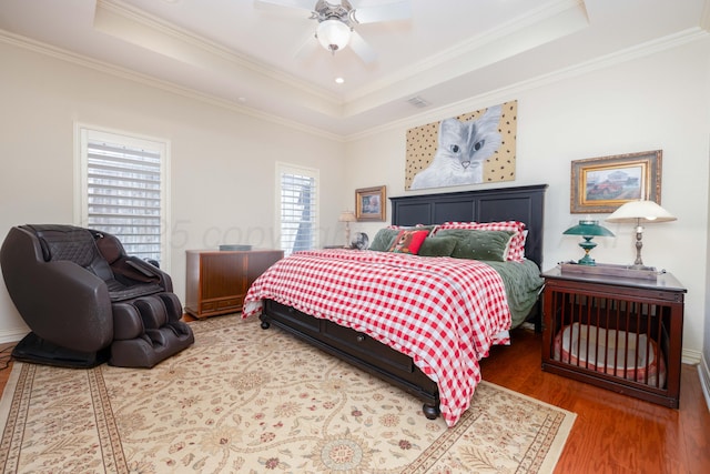 5007 Wesley Rd, Amarillo, TX 79119 - bedroom featuring a tray ceiling, wood finished floors, crown molding, and a ceiling fan