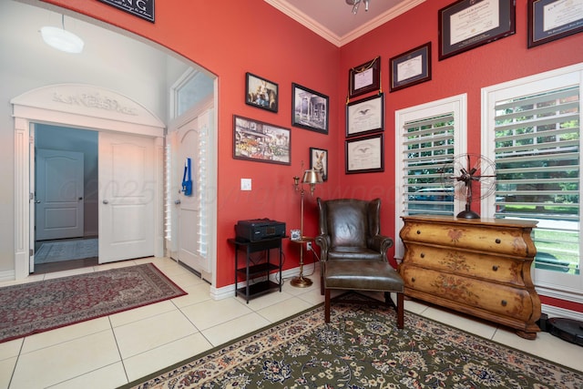 5007 Wesley Rd, Amarillo, TX 79119 - sitting room featuring arched walkways, ornamental molding, and light tile patterned flooring