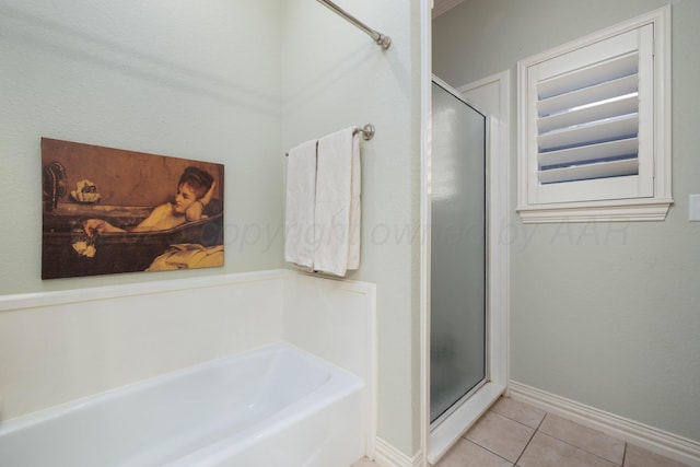 5007 Wesley Rd, Amarillo, TX 79119 - full bath featuring a stall shower, a bath, and tile patterned floors