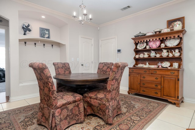 5007 Wesley Rd, Amarillo, TX 79119 - dining room with light tile patterned flooring, a chandelier, and ornamental molding