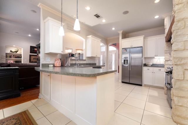 5007 Wesley Rd, Amarillo, TX 79119 - kitchen with stainless steel refrigerator with ice dispenser, dark countertops, light tile patterned flooring, a peninsula, and ornamental molding