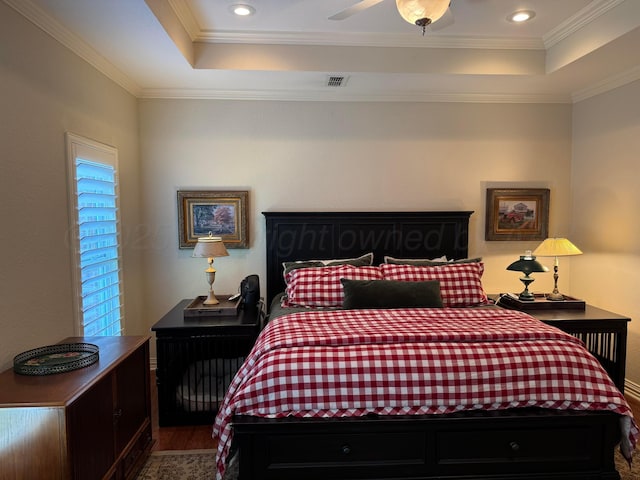 5007 Wesley Rd, Amarillo, TX 79119 - bedroom with a tray ceiling, wood finished floors, crown molding, and recessed lighting
