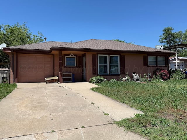 1030 Thrams St, Borger, TX 79007 - ranch-style house with a garage, concrete driveway, and a shingled roof