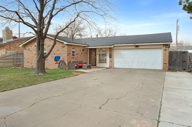 single story home with fence, an outdoor hangout area, concrete driveway, brick siding, and a garage