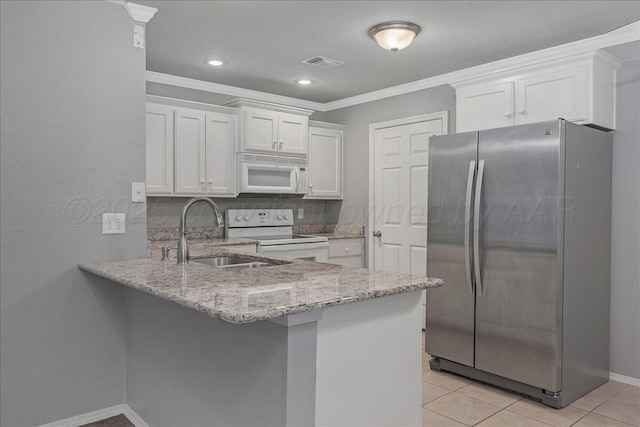 3610 S Mirror St, Amarillo, TX 79118 - kitchen featuring white appliances, a peninsula, white cabinets, light stone countertops, and crown molding