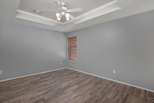 3610 S Mirror St, Amarillo, TX 79118 - empty room featuring a raised ceiling, wood finished floors, ornamental molding, and a ceiling fan