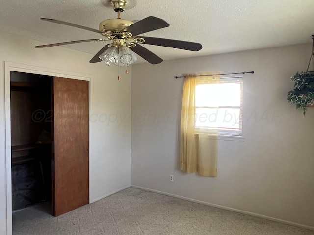 415 Mesquite Ave, Amarillo, TX 79108 - carpeted empty room with ceiling fan, baseboards, and a textured ceiling