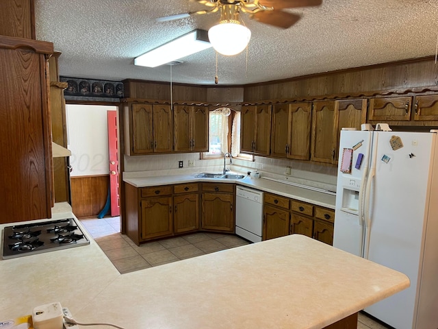 415 Mesquite Ave, Amarillo, TX 79108 - kitchen with white appliances, a sink, a textured ceiling, a ceiling fan, and light countertops