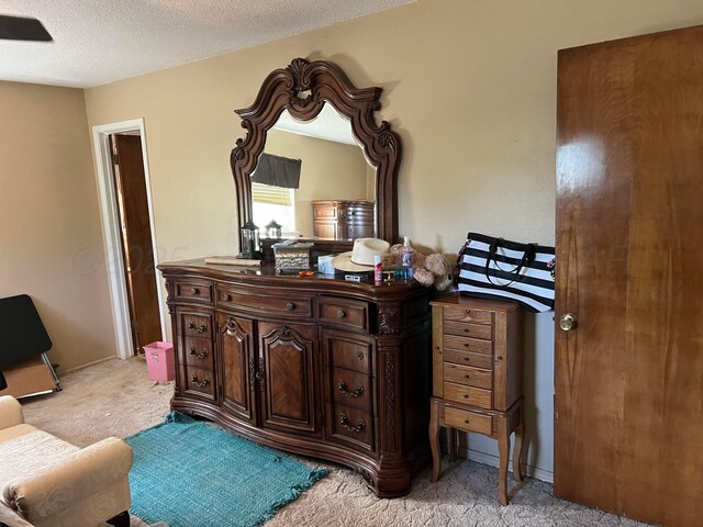 415 Mesquite Ave, Amarillo, TX 79108 - bedroom with light colored carpet and a textured ceiling