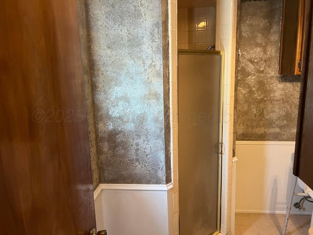 415 Mesquite Ave, Amarillo, TX 79108 - full bathroom featuring wainscoting, a stall shower, and tile patterned flooring