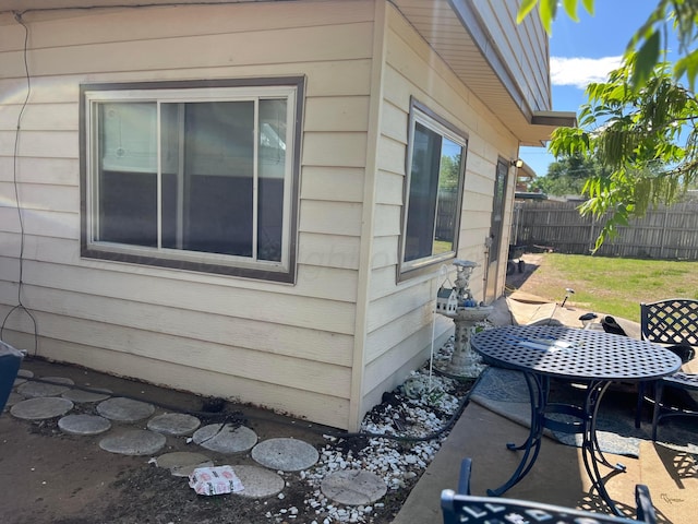 415 Mesquite Ave, Amarillo, TX 79108 - view of home's exterior with fence, a patio, and outdoor dining space