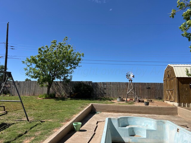 415 Mesquite Ave, Amarillo, TX 79108 - view of yard with a storage shed, an outbuilding, and a hot tub