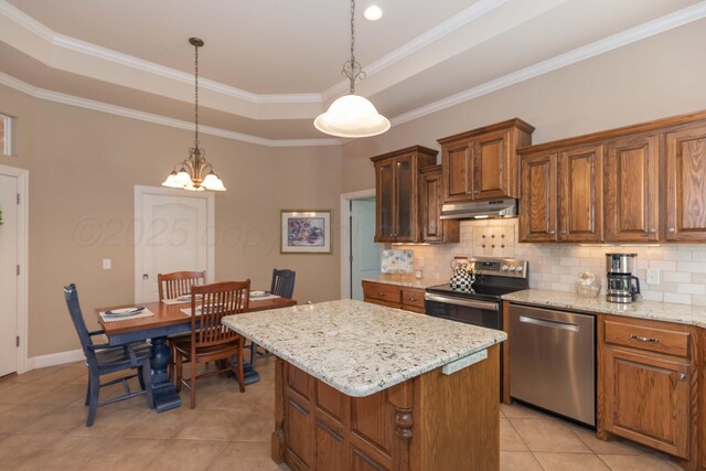 6600 Pepper Tree Pl, Amarillo, TX 79124 - kitchen with appliances with stainless steel finishes, under cabinet range hood, light tile patterned floors, backsplash, and ornamental molding
