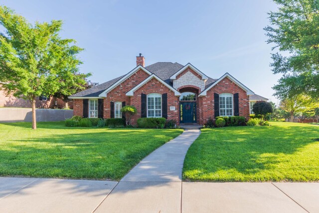 6600 Pepper Tree Pl, Amarillo, TX 79124 - view of front of property featuring a chimney, brick siding, stone siding, and roof with shingles