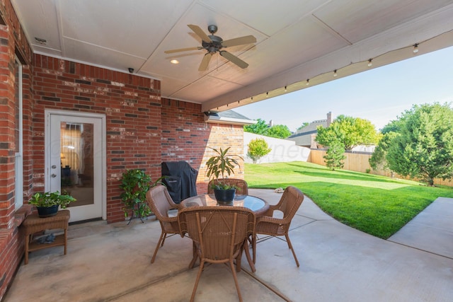 6600 Pepper Tree Pl, Amarillo, TX 79124 - fenced backyard featuring ceiling fan, a patio, outdoor dining area, and grilling area