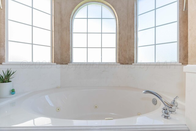 6600 Pepper Tree Pl, Amarillo, TX 79124 - bathroom featuring a tub with jets and plenty of natural light