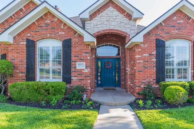 6600 Pepper Tree Pl, Amarillo, TX 79124 - view of exterior entry featuring brick siding and stone siding